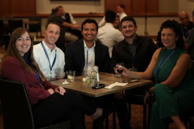 Five people gather around a table at the 2024 National Prosecution Best Practices Conference. 